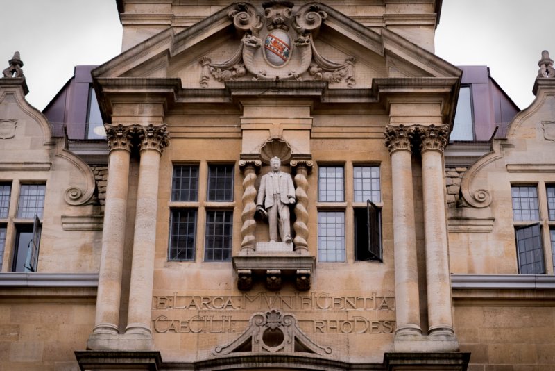 rhodesabovetheentrancetohisdearorielcollege.jpg